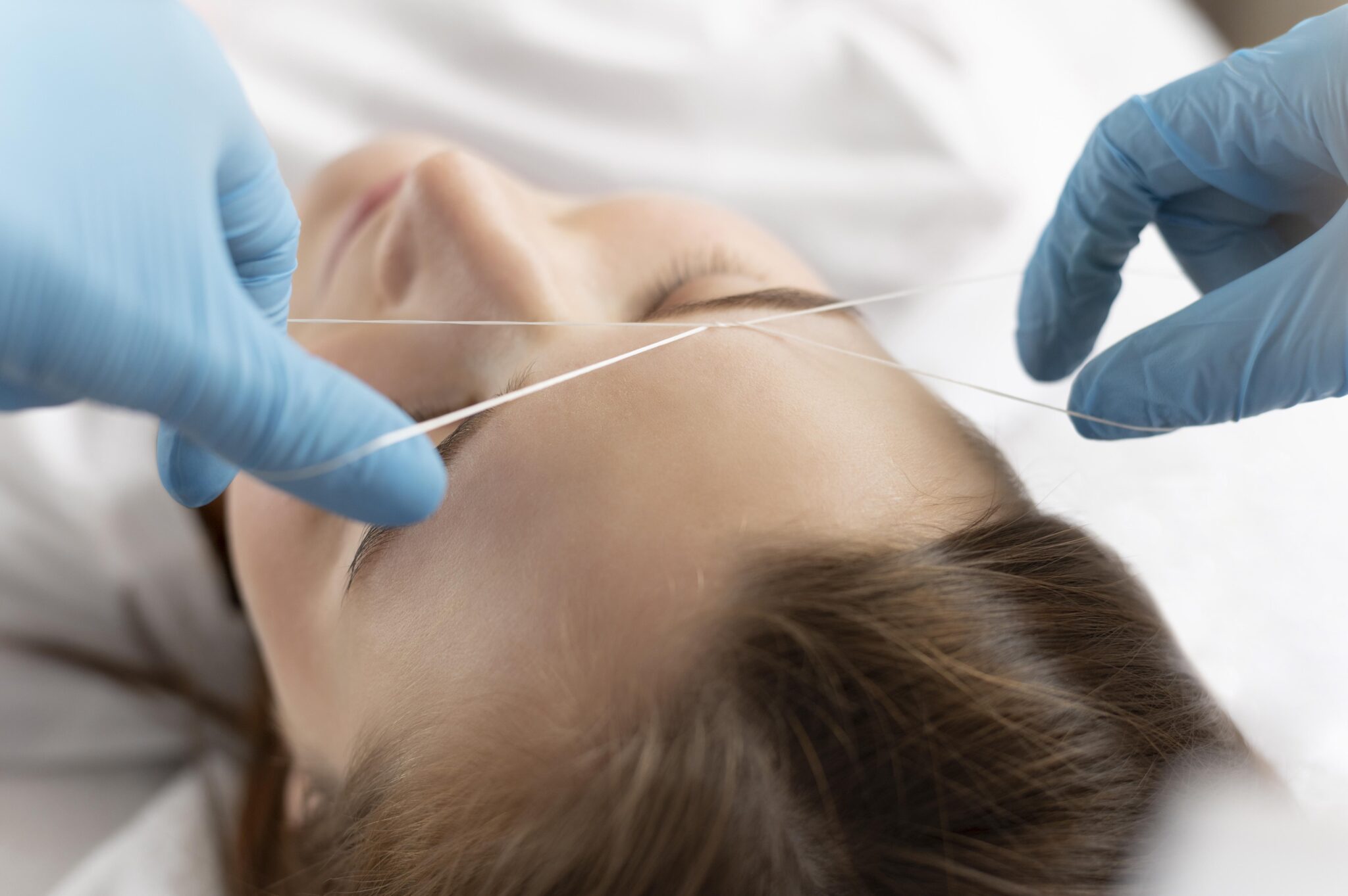 close-up-young-woman-getting-eyebrow-treatment copy